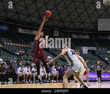 Honolulu, Hawaii, USA. 22nd Dec, 2023. Massachusetts forward Josh Cohen (23) shoots the ball during the Hawaiian Airlines Diamond Head Classic basketball game between the Massachusetts Minutemen and Portland Pilots at Sofi Arena in the Stan Sheriff Center in Honolulu, Hawaii. Glenn Yoza/CSM/Alamy Live News Stock Photo