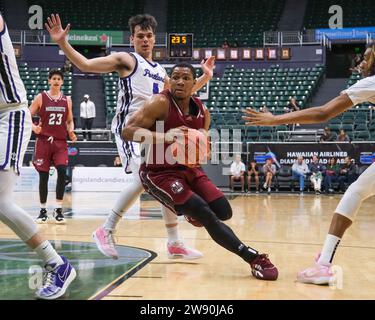 Honolulu, Hawaii, USA. 22nd Dec, 2023. Massachusetts guard Keon Thompson (5) drives to the basket during the Hawaiian Airlines Diamond Head Classic basketball game between the Massachusetts Minutemen and Portland Pilots at Sofi Arena in the Stan Sheriff Center in Honolulu, Hawaii. Glenn Yoza/CSM/Alamy Live News Stock Photo