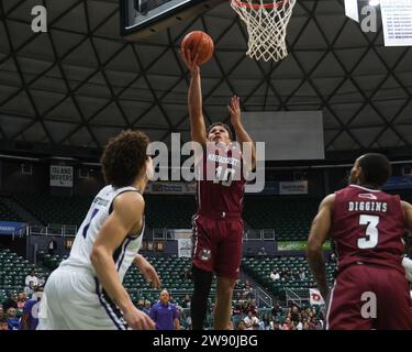 Honolulu, Hawaii, USA. 22nd Dec, 2023. Massachusetts guard Marqui Worthy (10) shoots the ball during the Hawaiian Airlines Diamond Head Classic basketball game between the Massachusetts Minutemen and Portland Pilots at Sofi Arena in the Stan Sheriff Center in Honolulu, Hawaii. Glenn Yoza/CSM/Alamy Live News Stock Photo