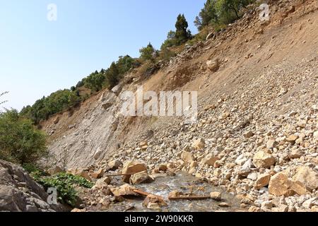 river at the foot of the waterfall near Arslanbob, Kyrgyzstan, Central Asia Stock Photo