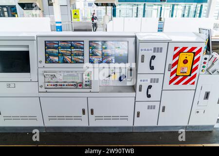 Japanese Shinkansen, bullet train, control station on the platform with overhead video feeds, buttons and display to show if gates are open or closed. Stock Photo