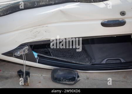 Close-up of Upside-Down Car Accident on Road Stock Photo