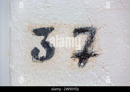 Old Weathered House Number 37, Drawing Stock Photo