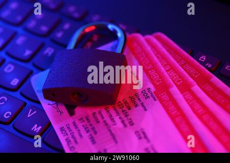 US Employment authorization card with small padlock on computer keyboard close up Stock Photo