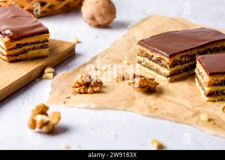 Gerbeaud Cake. Zserbo. Traditional Hungarian multi-layer cake with plum jam, nuts and covered with chocolate glaze Stock Photo