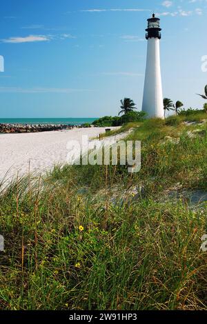 The Cape Florida Light in Key Biscayne stands tall at the edge of a beach Stock Photo