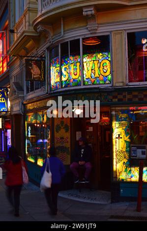 Folks wander past Vesuvio Tavern, a popular haunt of The Beat Writers Jack Kerouac and Allen Ginsburg, in the North Beach district of San Francisco Stock Photo