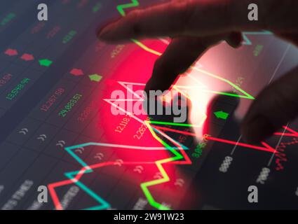 Trader analyzing financial performance data on screen Stock Photo