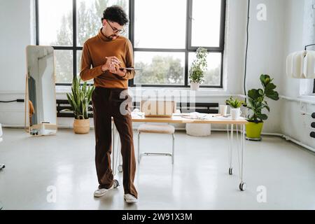 Graphic designer working near desk at office Stock Photo