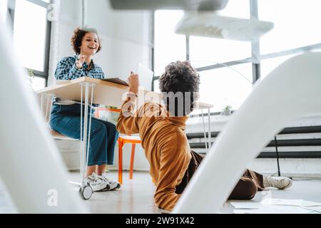 Design illustrators having fun at office Stock Photo