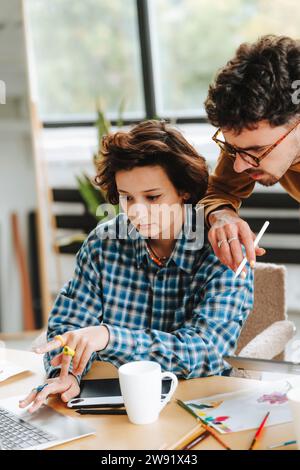 Concentrated graphic designers working on laptop at office Stock Photo