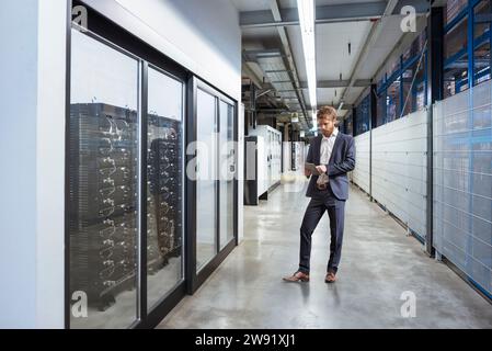 Manager using tablet PC at industry Stock Photo