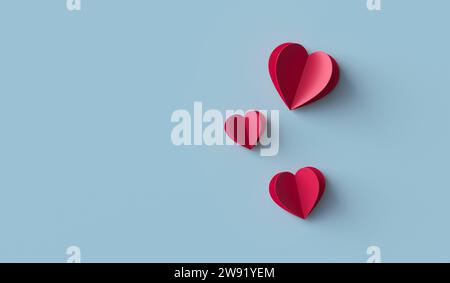 Red paper hearts on blue background Stock Photo