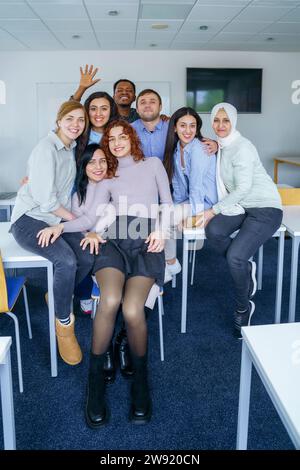 Multi-ethnic smiling students in training class at classroom Stock Photo