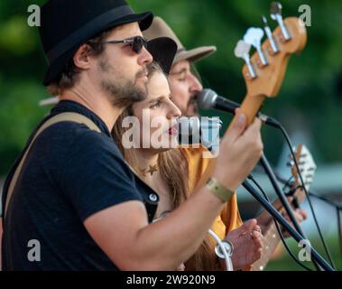 Local woman singer/songwriter Kelly Bayfield on stage with friends at the Maverick Americana music festival in rural Suffolk. Stock Photo