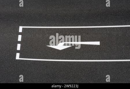 Left turn road marking on asphalt road Stock Photo