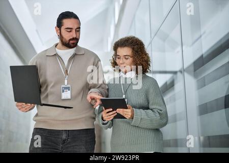 IT professionals discussing over tablet PC in office Stock Photo