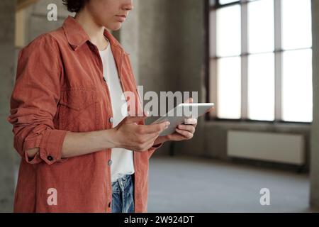 Engineer using tablet PC at construction site Stock Photo