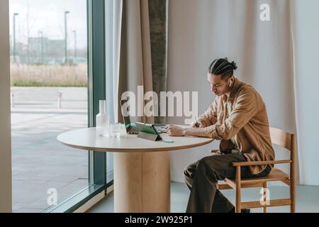 Young student studying at home Stock Photo - Alamy