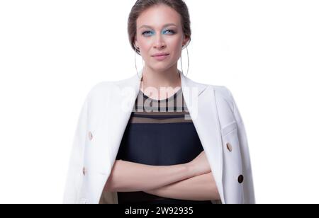 Portrait of a beautiful business woman in a white jacket. White background. The concept of management, coworking, recruiting. High quality Stock Photo