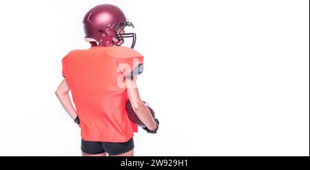 Woman in the uniform of an American football team player posing in the studio. White background. Back view. Sports concept. Mixed media Stock Photo