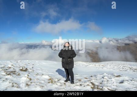 Portrait young latina woman in the snow Stock Photo