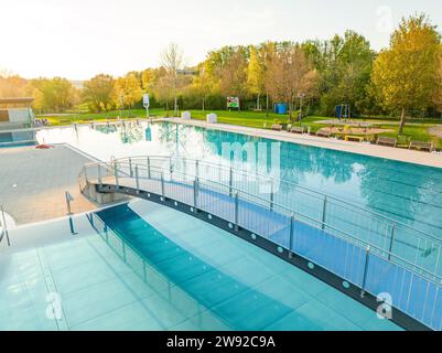 Drone photography of a swimming pool in the early morning fog, Calw outdoor pool, Stammheim of the Calw public utility company, Black Forest, Germany Stock Photo