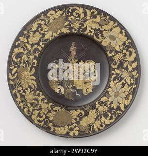 Decorative Dish, anonymous, c. 1650 - c. 1660 plate (dishes) Plate with gilded paintwork and colored paintwork on black stock. The flat edge is decorated with flowers and leaf vines in gold lacquer. In the middle the weapon of Huydecoper with helmet and archer as a helmet sign. The figure, used to the right, is pink, arrow and arch showing remains of red. Around the shield and the helmet Arcanthus leaves in gold, dark gray and dirty white. The downside of the board is orange. Japan wood (plant material). lacquer (coating). gilding (material) lacquering / gilding Stock Photo