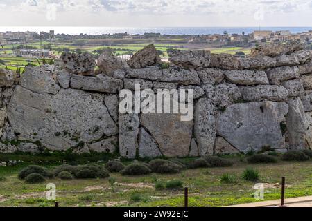 Up to 6 meters high and older than the Egyptian pyramids are the temples on the island of Gozo, which belongs to Malta. The Ġgantija temples on the island of Gozo are part of the UNESCO World Heritage Site Megalithic Temples of Malta and the oldest half-preserved freestanding buildings in the world. Xaghra, Malta Stock Photo