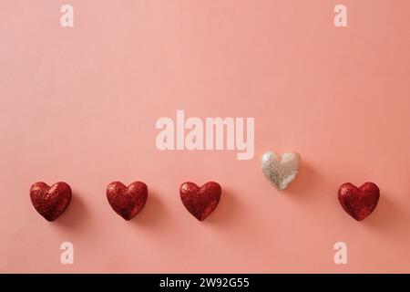3D rendering of shiny and red glowing heart on pink background with copy space. Valentine's Day celebration concept. Stock Photo