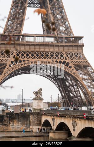 The Pont d'Iena over the Seine river and the Eiffel Tower in autumn in the rain in Paris - France Stock Photo