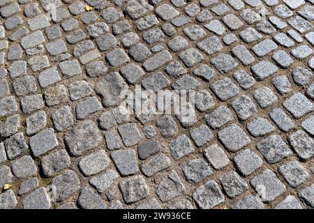 a road made of stones and cobblestones, details of a highway made of stones and cobblestones Stock Photo