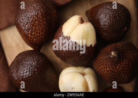 Fresh salak fruits on wooden board, top view Stock Photo
