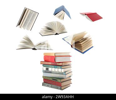 Books flying over stack on white background Stock Photo