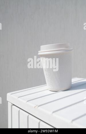 Discarded  white takeaway paper cardboard cup for hot beverage Stock Photo