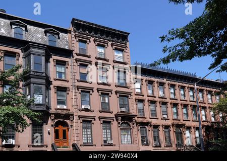 Street with old brownstone apartment buildings in New York City Stock Photo