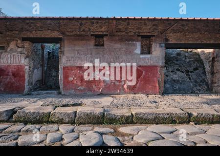 Naples, Italy - November 8 2023: : Ancient Latin graffiti on a wall of one of the ruins at Pompeii Stock Photo