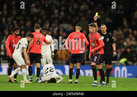 London, UK. 23rd Dec, 2023. Nathan Patterson of Everton receives a yellow card from Referee Stuart Attwell for a foul on Brennan Johnson of Tottenham Hotspur during the Premier League match between Tottenham Hotspur and Everton at Tottenham Hotspur Stadium, London, England on 23 December 2023. Photo by Ken Sparks. Editorial use only, license required for commercial use. No use in betting, games or a single club/league/player publications. Credit: UK Sports Pics Ltd/Alamy Live News Stock Photo