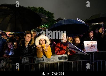 Israel. 23rd Dec, 2023. Israeli protestors during a demonstration attended by thousands under pouring rain calling Prime Minister Benjamin Netanyahu to resign. The sign reads “transitional government is BETTER then Netanyahu's government”. Tel Aviv, Israel. Dec 23th 2023. (Matan Golan/Sipa USA). Credit: Sipa USA/Alamy Live News Stock Photo