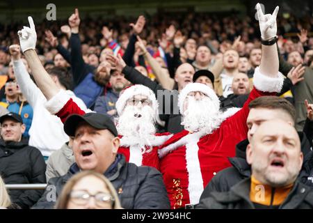 Wolverhampton Wanderers fans dressed as Santa Claus before the Premier League match at Molineux Stadium, Wolverhampton. Picture date: Sunday December 24, 2023. Stock Photo