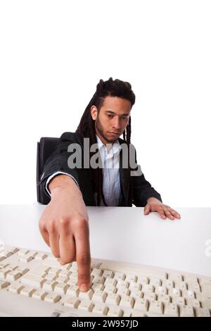Rastafari businessman pressing a key on the keyboard Stock Photo