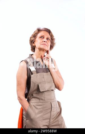 Happy senior woman with construction clothes (isolated on white) Stock Photo