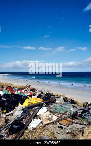 Orkney Islands Scotland litter dumped on the beach seals lying on the sand under a blue sky Stock Photo