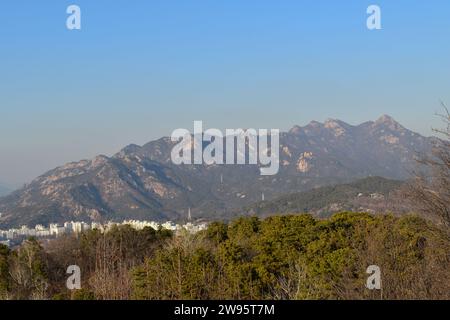 View of the majestic mountains of Bukhansan National Park in Seoul seen from the observatory platform in Baengnyeon Neighborhood Park Stock Photo