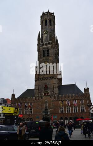 The majestic medieval Belfort clock tower in front of the Grand Place in the city centre of Bruges Stock Photo