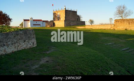 Keep of the Castle of Abrantes, ancient church of Santa Maria do Castelo in the background, view in sunset light, Abrantes, Portugal Stock Photo