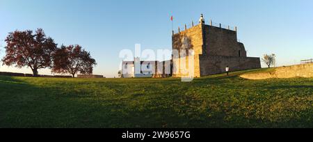 Keep of the Castle of Abrantes, ancient church of Santa Maria do Castelo in the background, panoramic shot in sunset light, Abrantes, Portugal Stock Photo