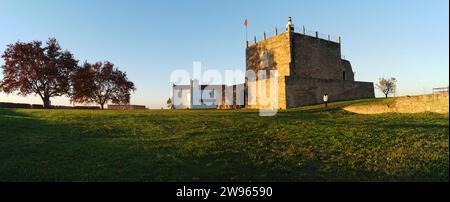 Keep of the Castle of Abrantes, ancient church of Santa Maria do Castelo in the background, panoramic shot in sunset light, Abrantes, Portugal Stock Photo