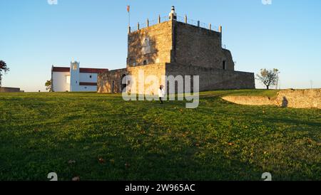Keep of the Castle of Abrantes, ancient church of Santa Maria do Castelo in the background, view in sunset light, Abrantes, Portugal Stock Photo