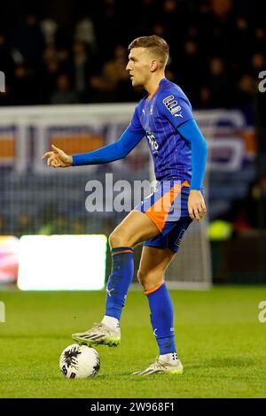 Mark Kitching of Oldham Athletic Association Football Club clears from ...